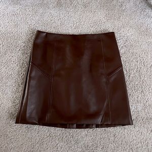 Cute faux brown leather mini skit! Fits like a size 8.